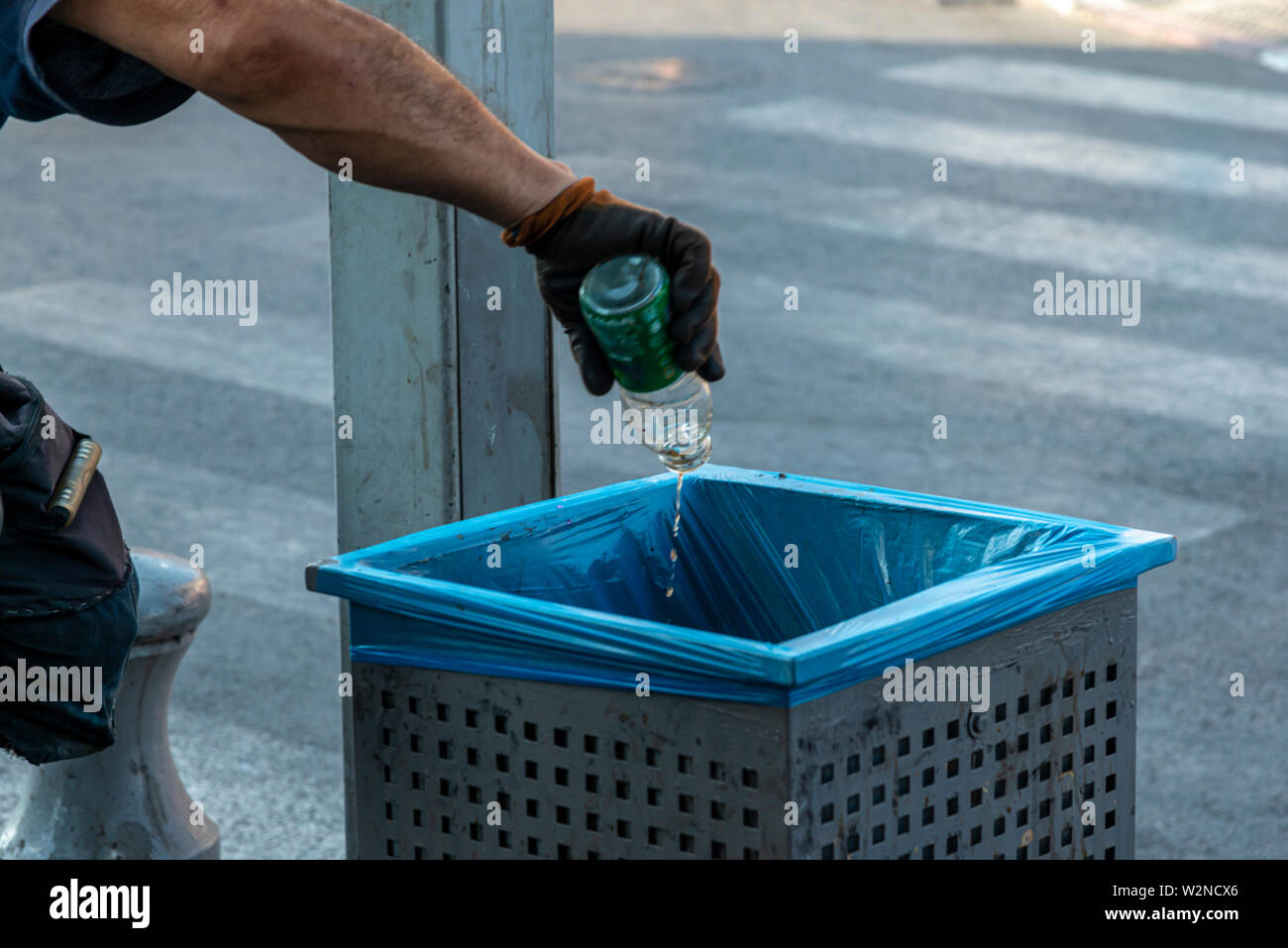 Recycling glass bottles from the street garbage bin Stock Photo Alamy