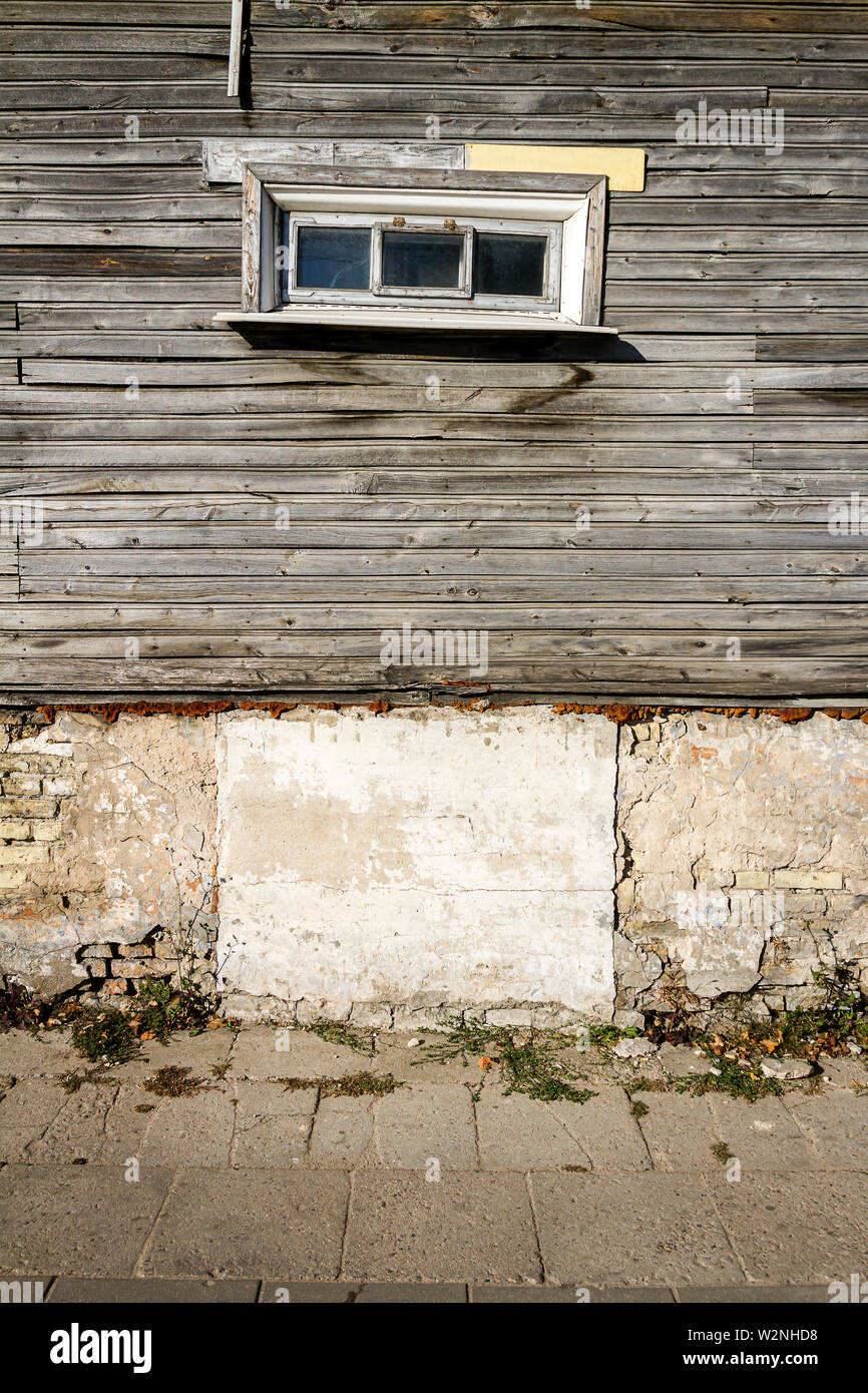 Old window on a aged wooden plank wall. Architectural detail ...