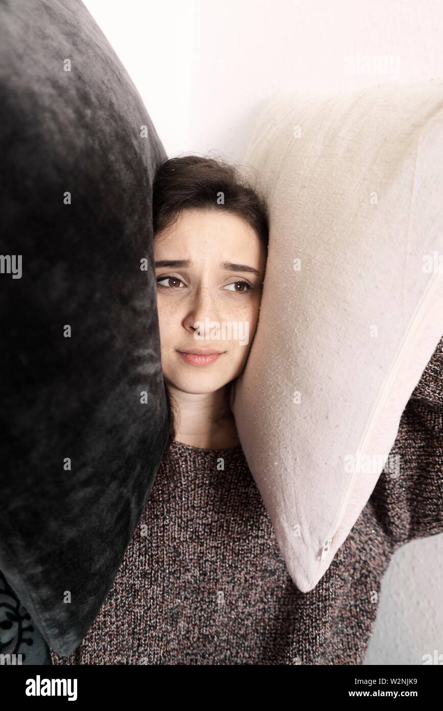lonely woman pressing pillows on head Stock Photo Alamy