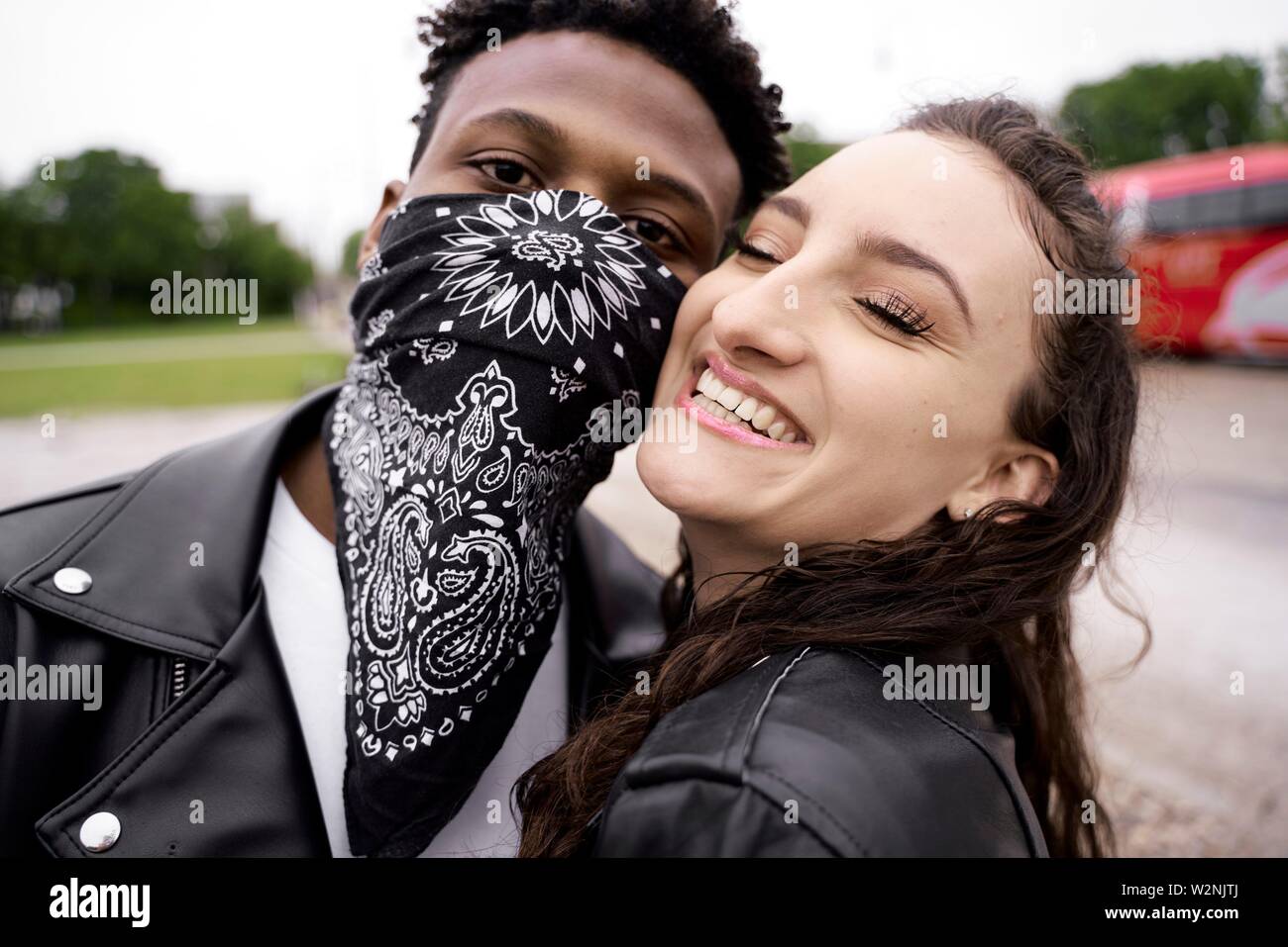 happy woman with bad boy at street in city, in Munich, Germany Stock Photo
