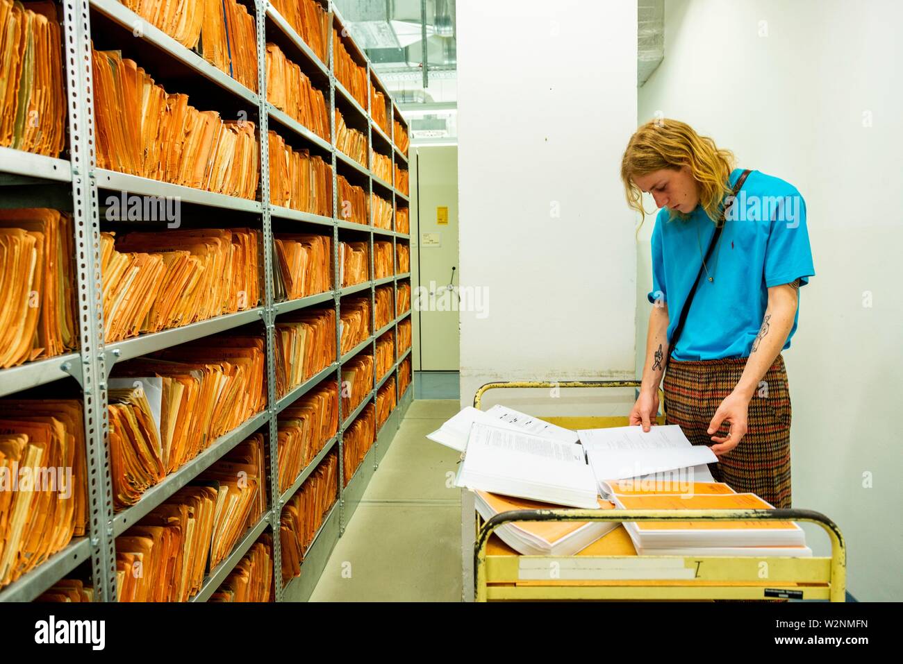 Berlin, Germany. Even young people, born after the Berlin Wall was torn down, are interested to read about and investigate what the MfS Stasi was up Stock Photo