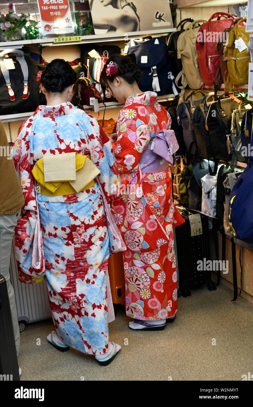 Girls dressed in rental kimono in a shop of Asakusa, Tokyo, Asia. Stock Photo