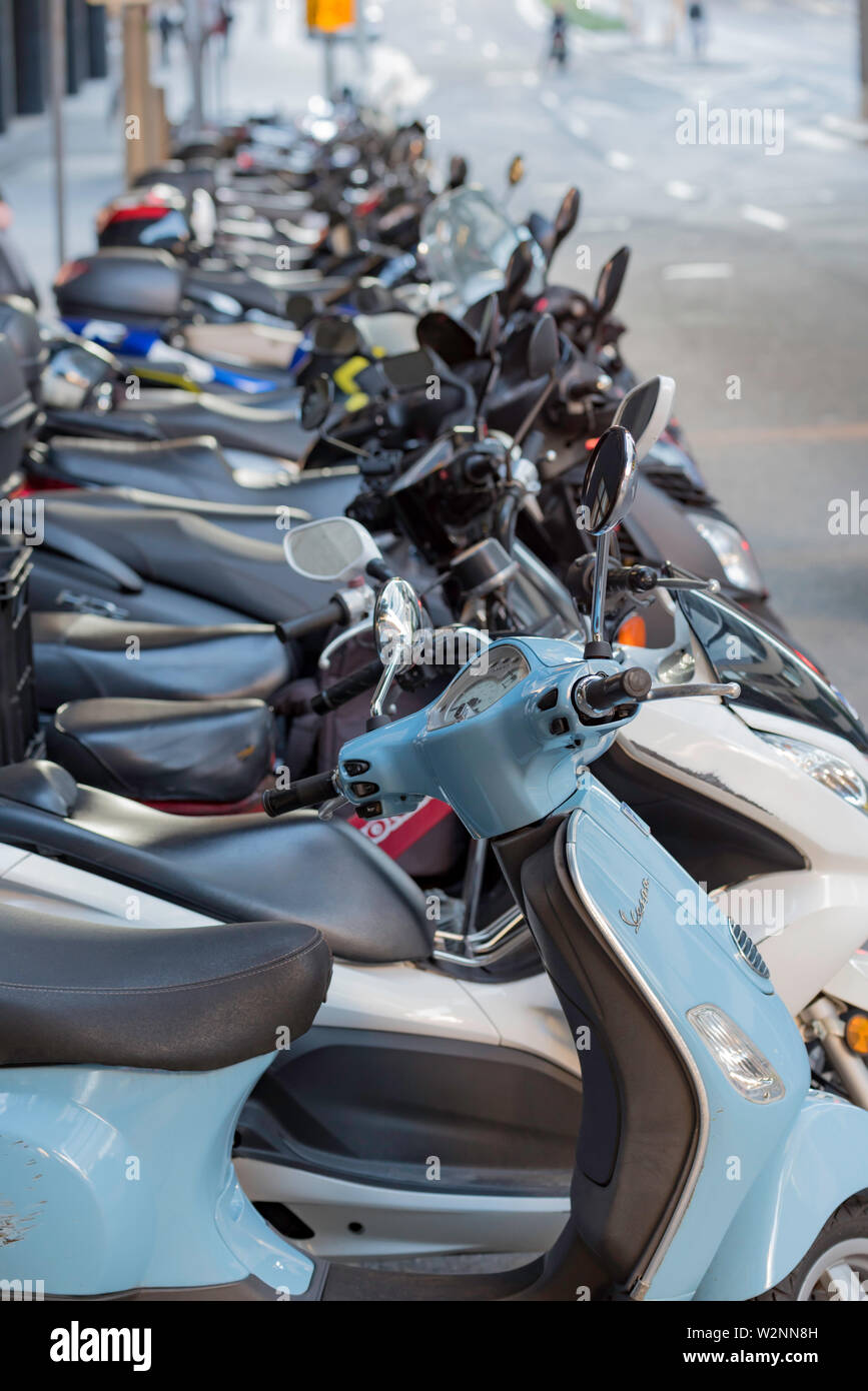 A long line of motor bikes and motor scooters parked in inner Sydney Stock Photo