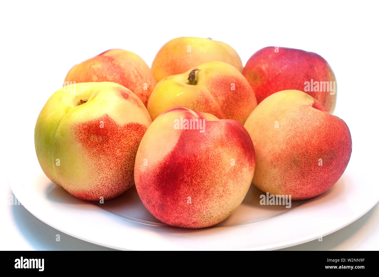 Fresh nectarines isolated on white background Stock Photo