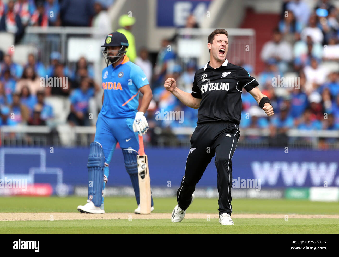 New Zealand's Matt Henry celebrates taking the wicket of India's ...