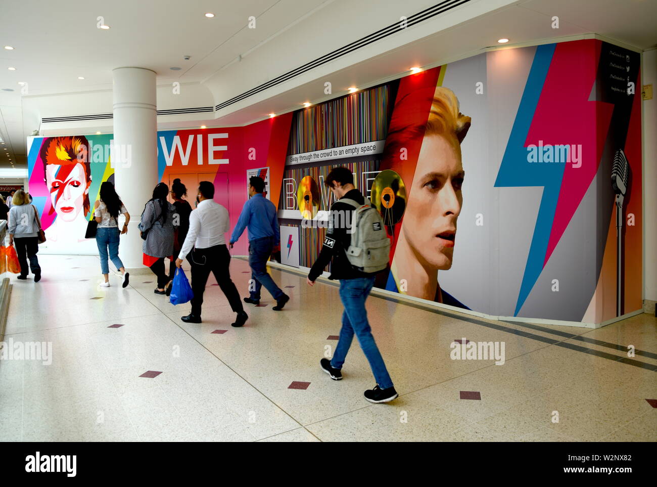An audio visual display celebrating the music of Bromley's famous son the rockstar and artist David Bowie, in the Glades shopping centre in Bromley. Stock Photo
