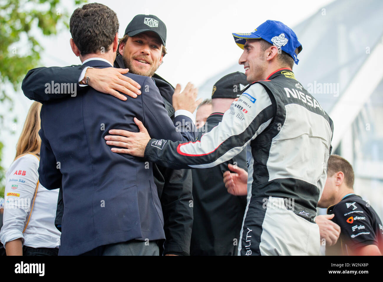 Carl Gurdjian and Sebastien Buemi at the award ceremony following the Julius Baer Formula E Championship race in Bern. The swiss driver Sebastien Buemi, who is at the end of his contract with Nissan, came in third in the race. Stock Photo