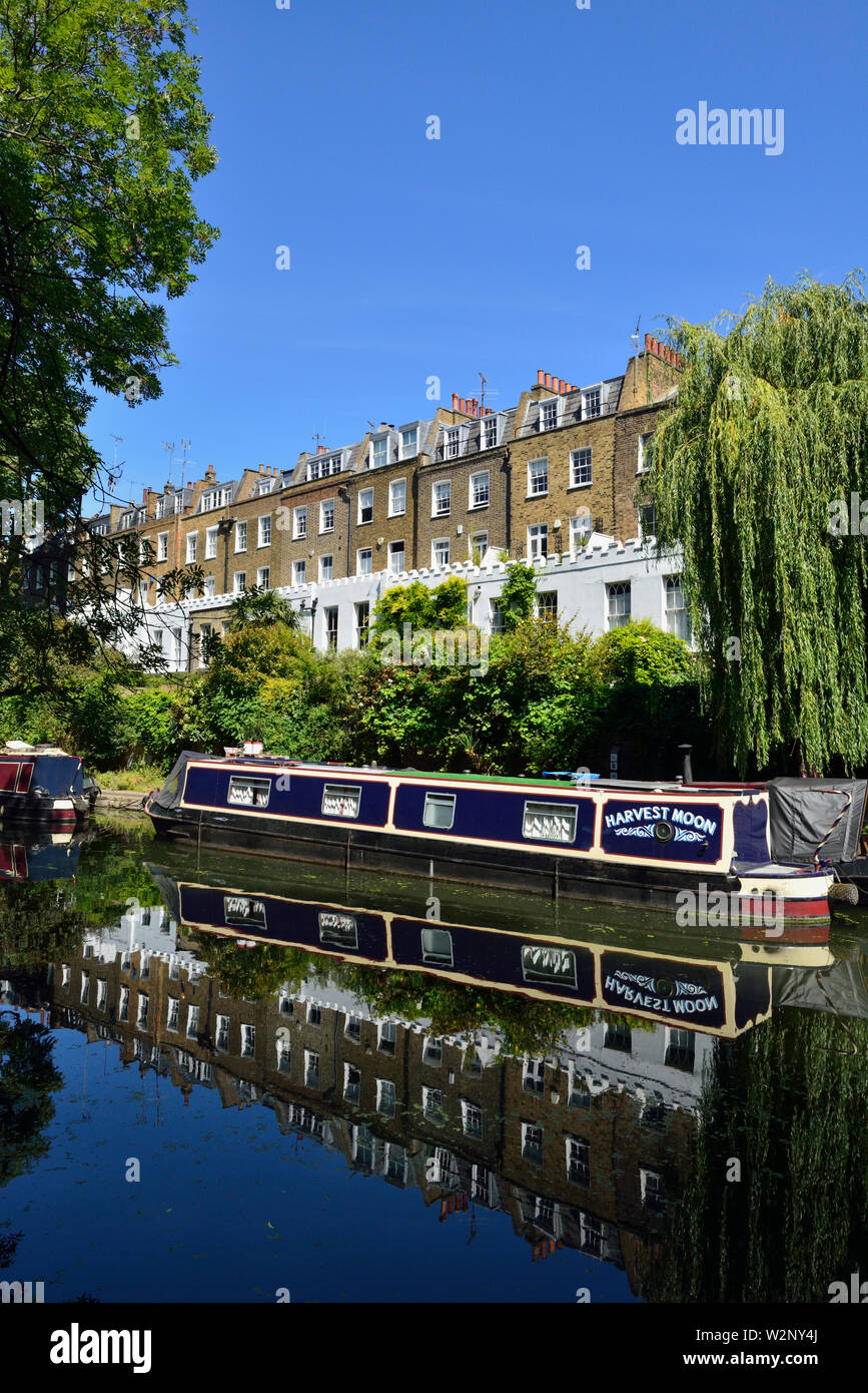 Blue and cream moored barge, Regent's Canal, Colebrooke Row, Noel Road residential terraced houses, Islington, London, United Kingdom Stock Photo
