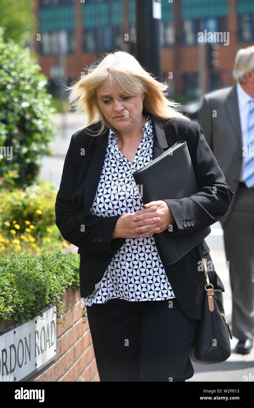 Sherry Bray, 48, leaves Swindon Magistrates' Court where she and Christopher Ashford, 62, were summonsed to appear over an image that allegedly showed the remains of footballer Emiliano Sala at the Holly Tree Lodge mortuary in Bournemouth. Stock Photo