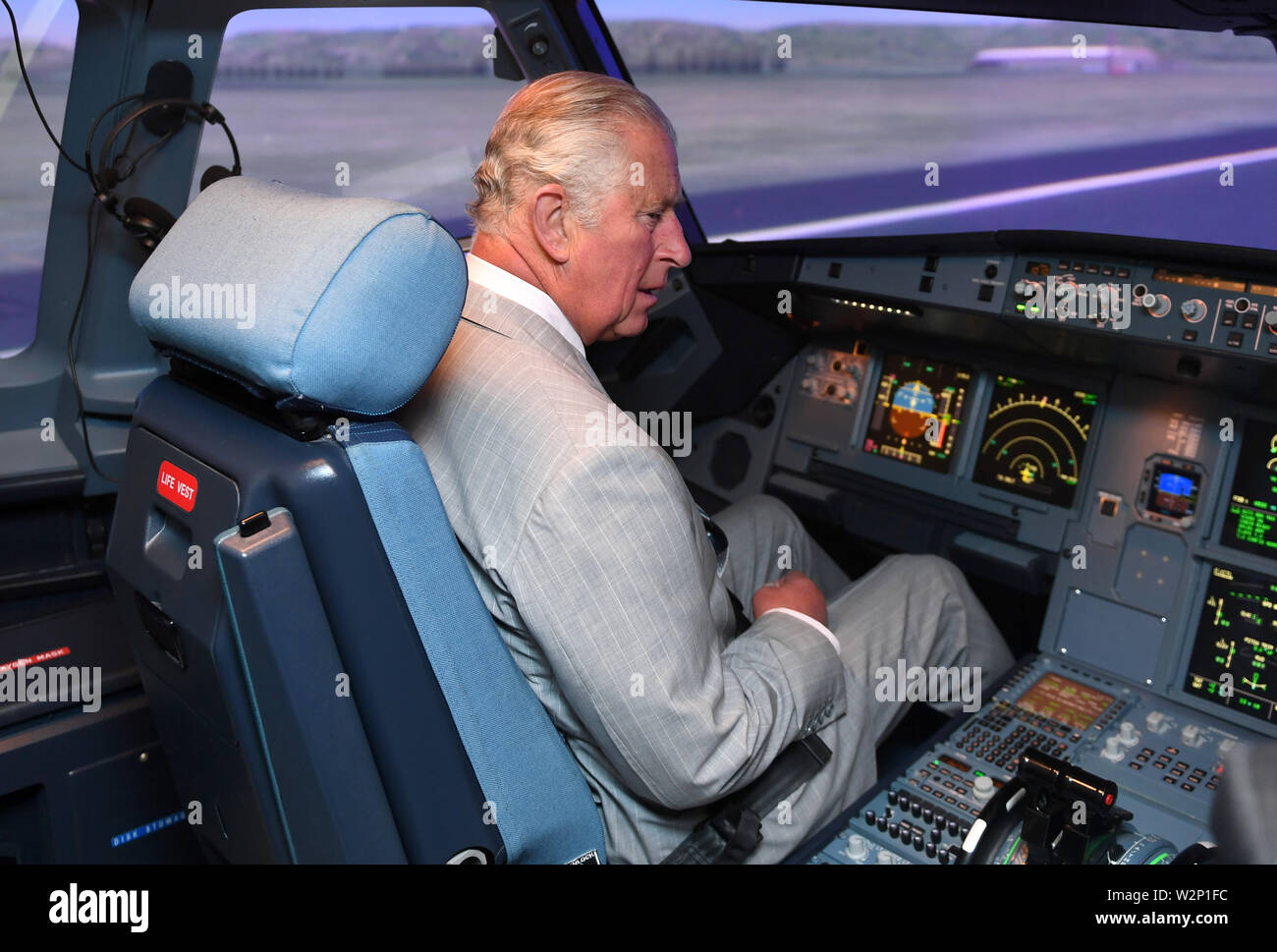 The Prince of Wales takes part in a pre-flight briefing and simulation during a visit to officially open the L3Harris Technologies' London Training Centre in Crawley, West Sussex. Stock Photo