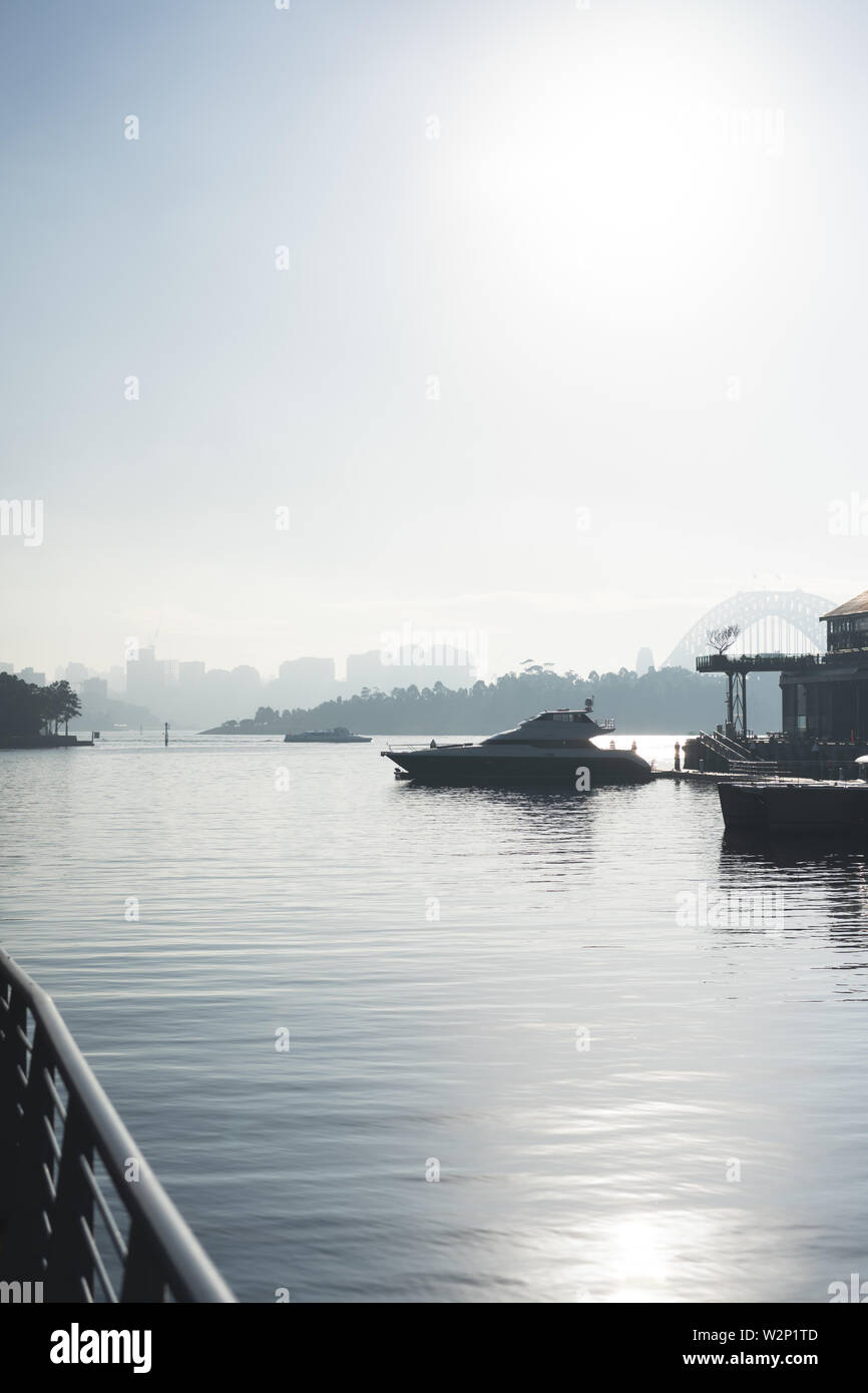 Early morning sun haze over the water at Pirrama Park/Jones Bay Wharf, Sydney NSW. June 2019 Stock Photo