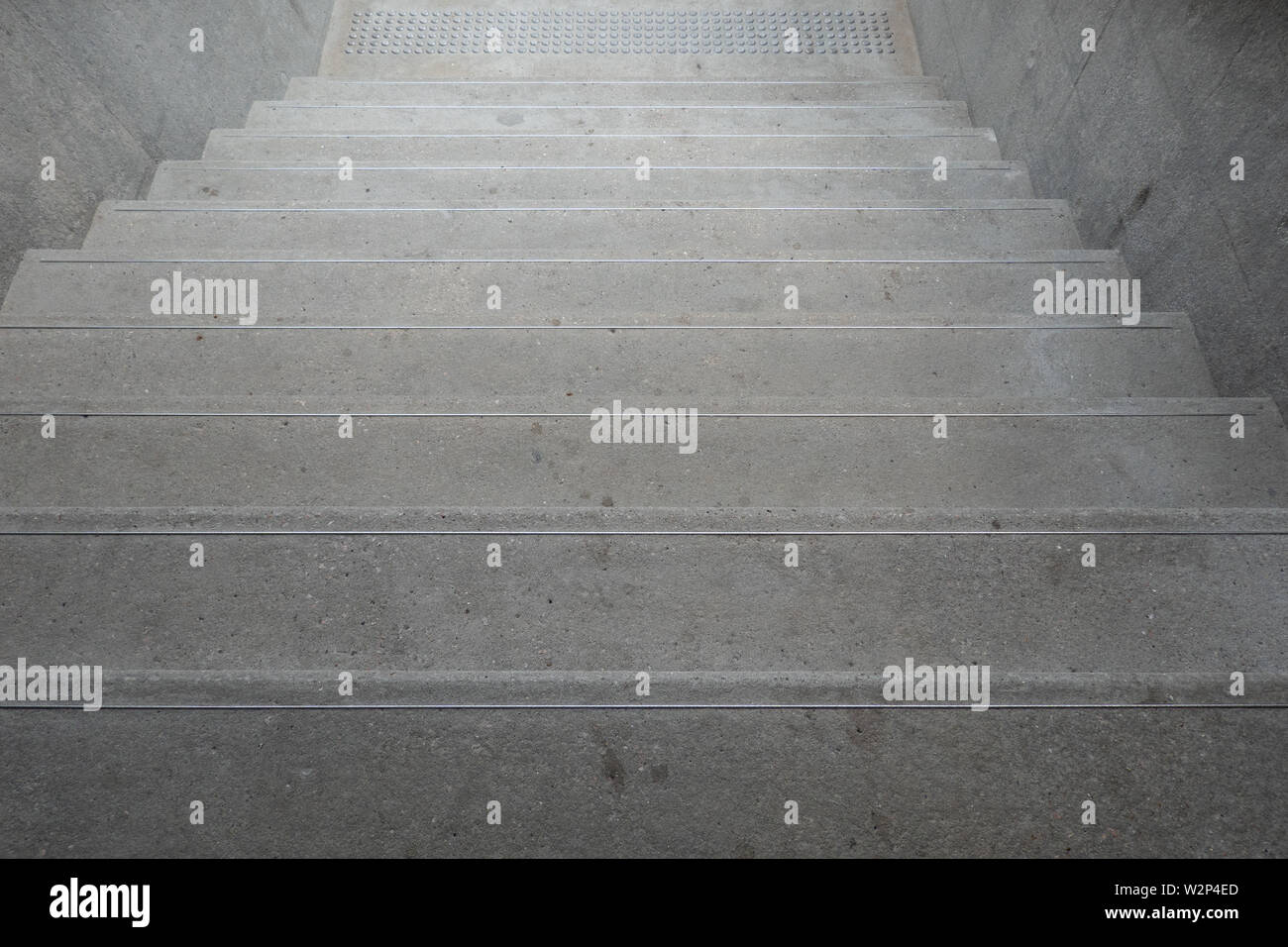 Up and down stairs with handrails for balancing while climbing the stairs Safety building design concept Stock Photo