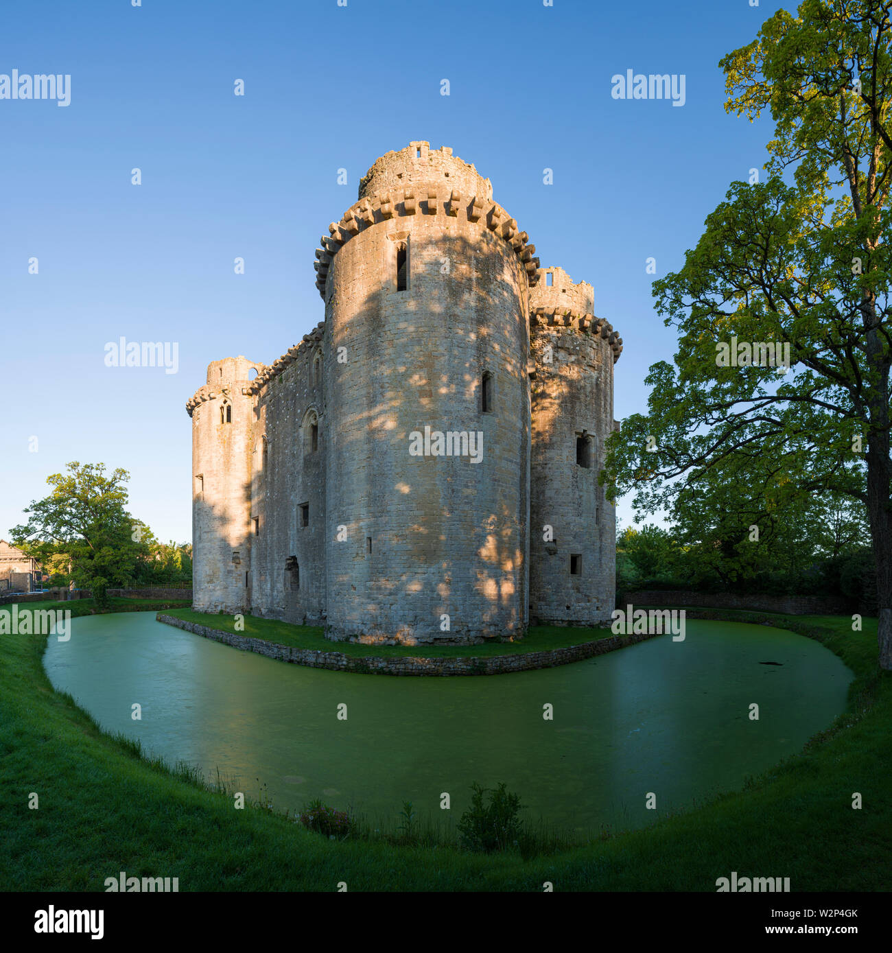 Nunney Castle and moat in the village of Nunney, Somerset, England. Stock Photo