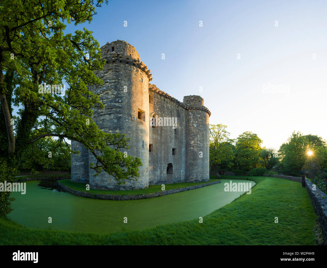 Nunney Castle and moat in the village of Nunney, Somerset, England. Stock Photo