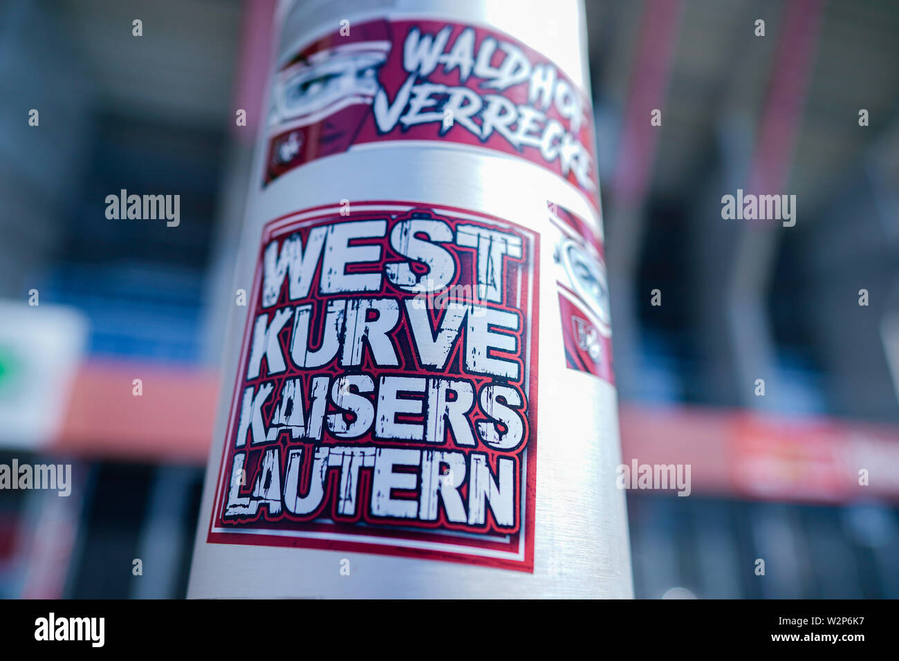 kaiserslautern-germany-10th-july-2019-soccer-3rd-league-1st-fc-kaiserslautern-photo-session-for-the-201920-season-in-the-fritz-walter-stadium-stickers-with-the-inscription-waldhof-verrecke-an-allusion-to-the-waldhof-mannheim-club-and-westkurve-kaiserslautern-are-attached-to-a-flagpole-at-a-stadium-entrance-credit-uwe-anspachdpaalamy-live-news-W2P6K7.jpg