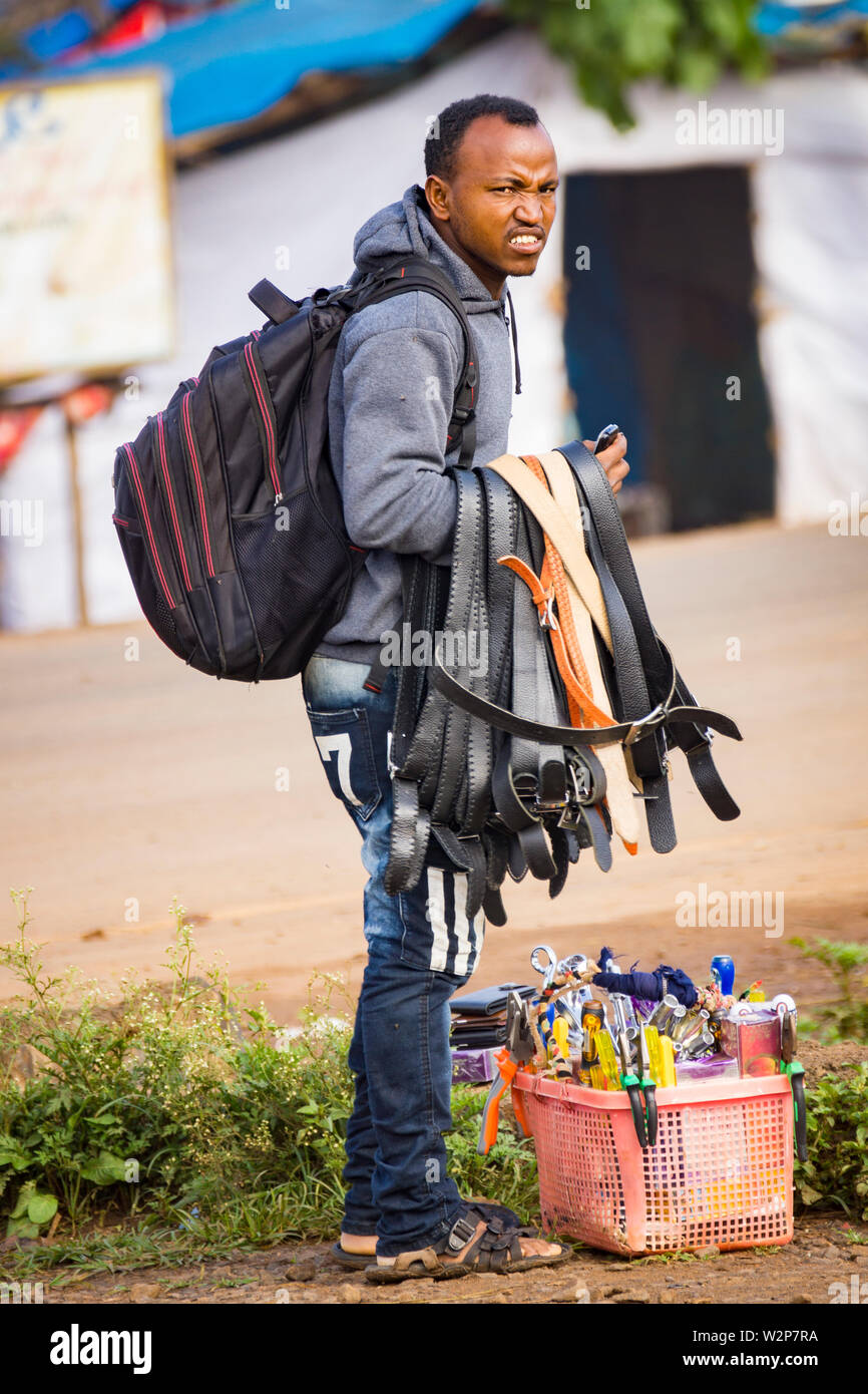 Young male trader selling goods by the roadside in Bonga, Ethiopia Stock Photo