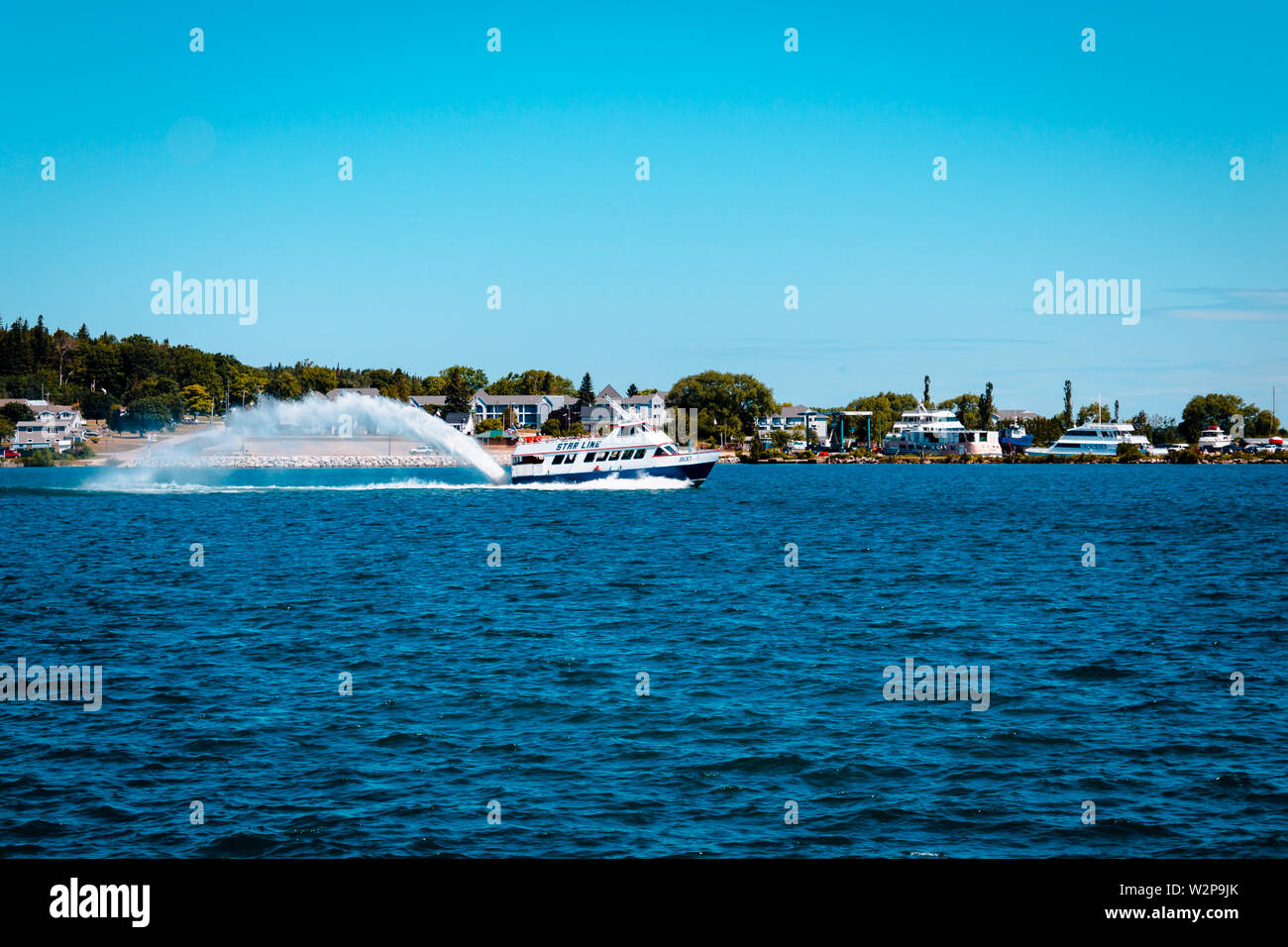 Boat leaving St. Ignace on Lake Michigan Stock Photo Alamy