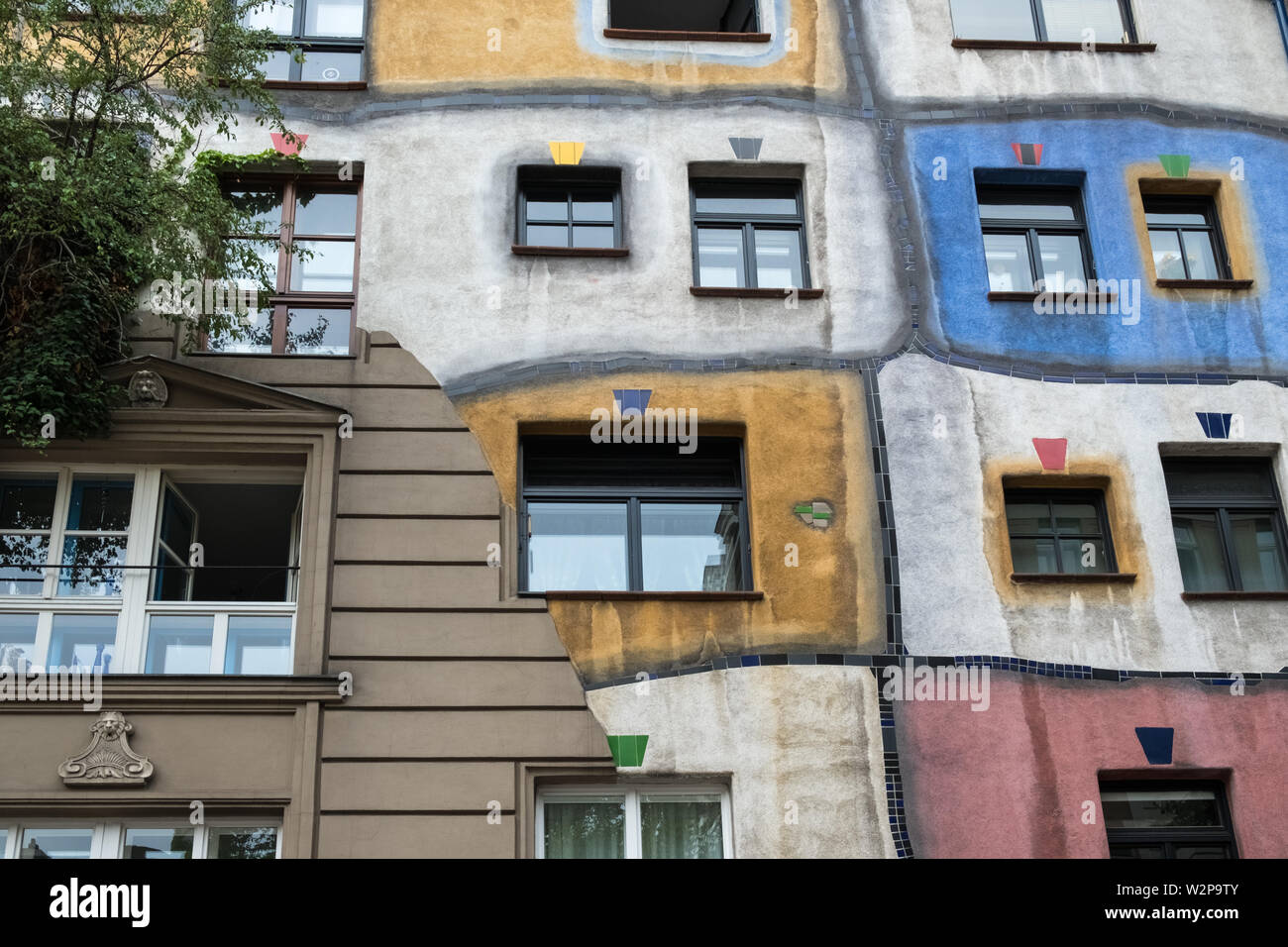 Hundertwasserhaus, designed by artist architect Friedensreich Hundertwasser (a pseudonym), a local landmark and tourist attraction, Vienna, Austria. Stock Photo