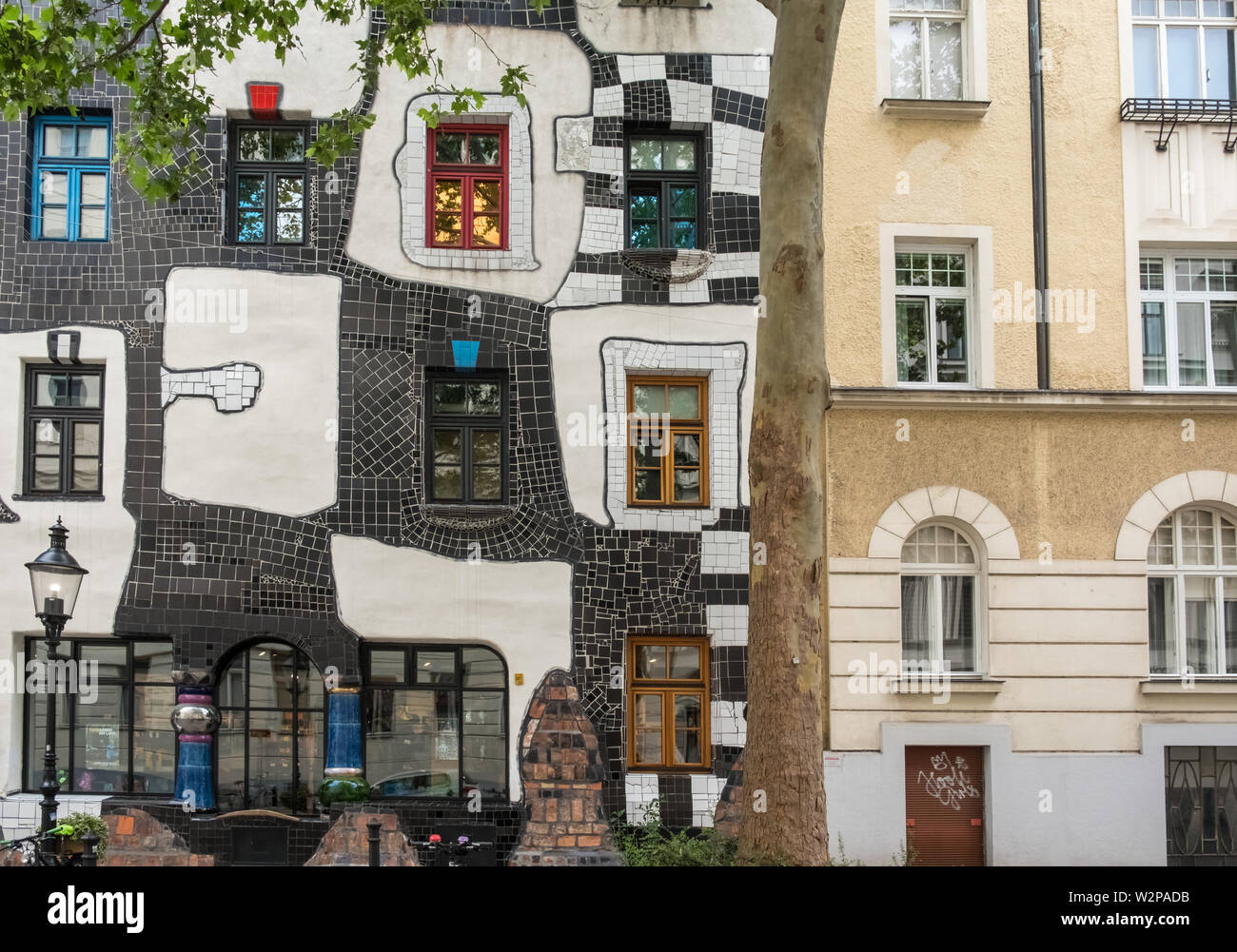 Exterior of KunstHausWien (left), a museum for artist and architect Friedensreich Hundertwasser, Landstrabe District, Vienna, Austria Stock Photo