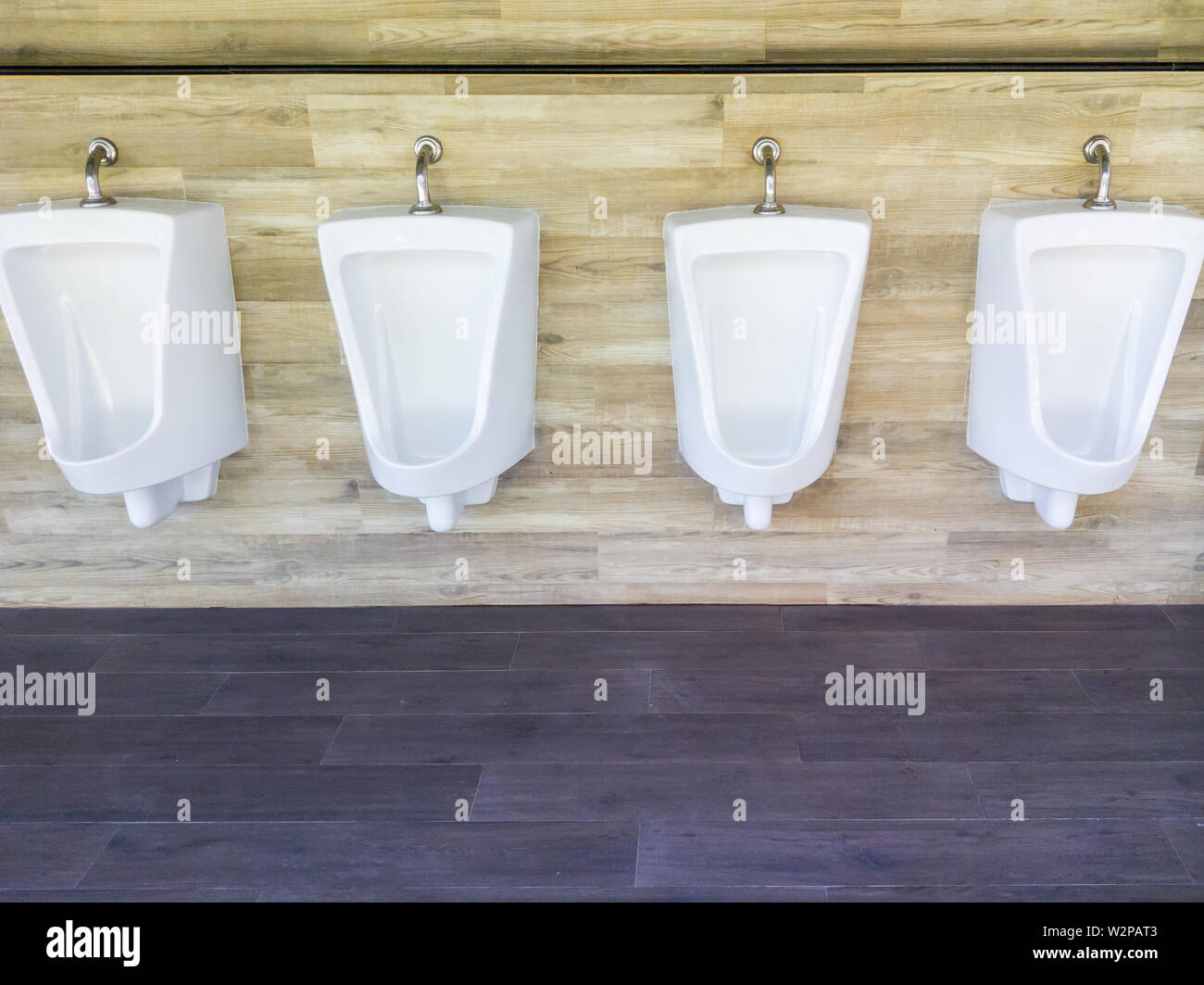 Porcelain urinal row in the public restroom of the gas Station Stock Photo Alamy