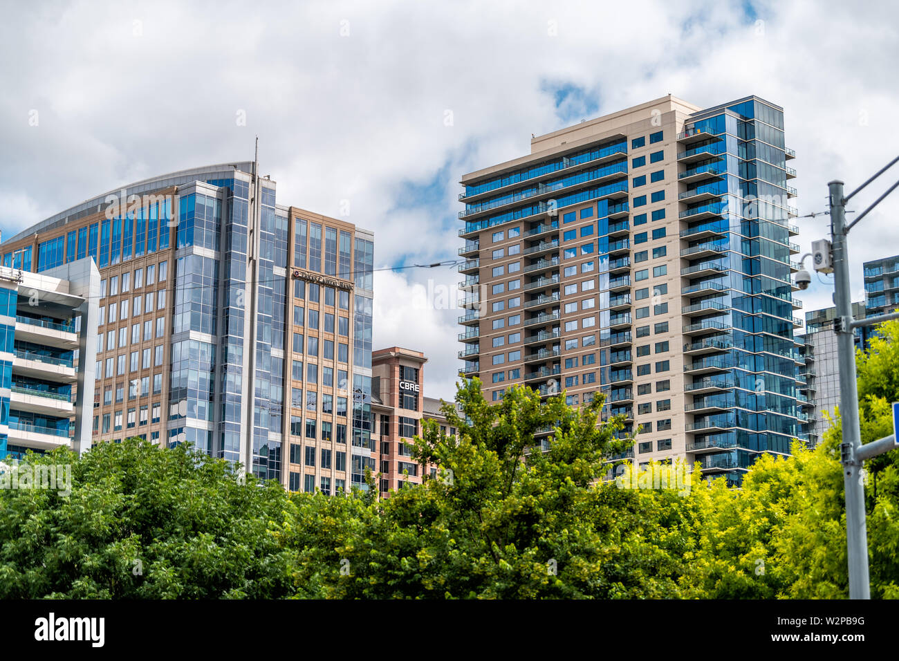 Dallas, USA - June 7, 2019: Downtown cityscape buildings in city near Klyde Warren park with sign for Texas Capital Bank and CBRE Stock Photo