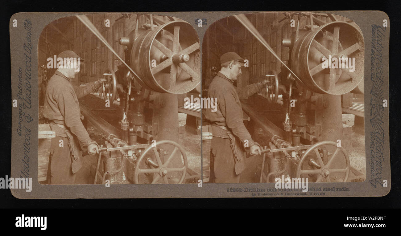 Drilling bolt holes in finished steel rails.; Underwood & Underwood Stereographs of Manufacturing Industries,  Set 6 - Rolling mills for steel,  Image 42 - Drilling bolt holes in finished steel rails.  These stereographs were created and sold as a set for educational use by Underwood & Underwood, a maker of stereoscopic images and equipment. This set was produced between 1895, when the educational unit was established, and 1921, when the company was sold. Stock Photo