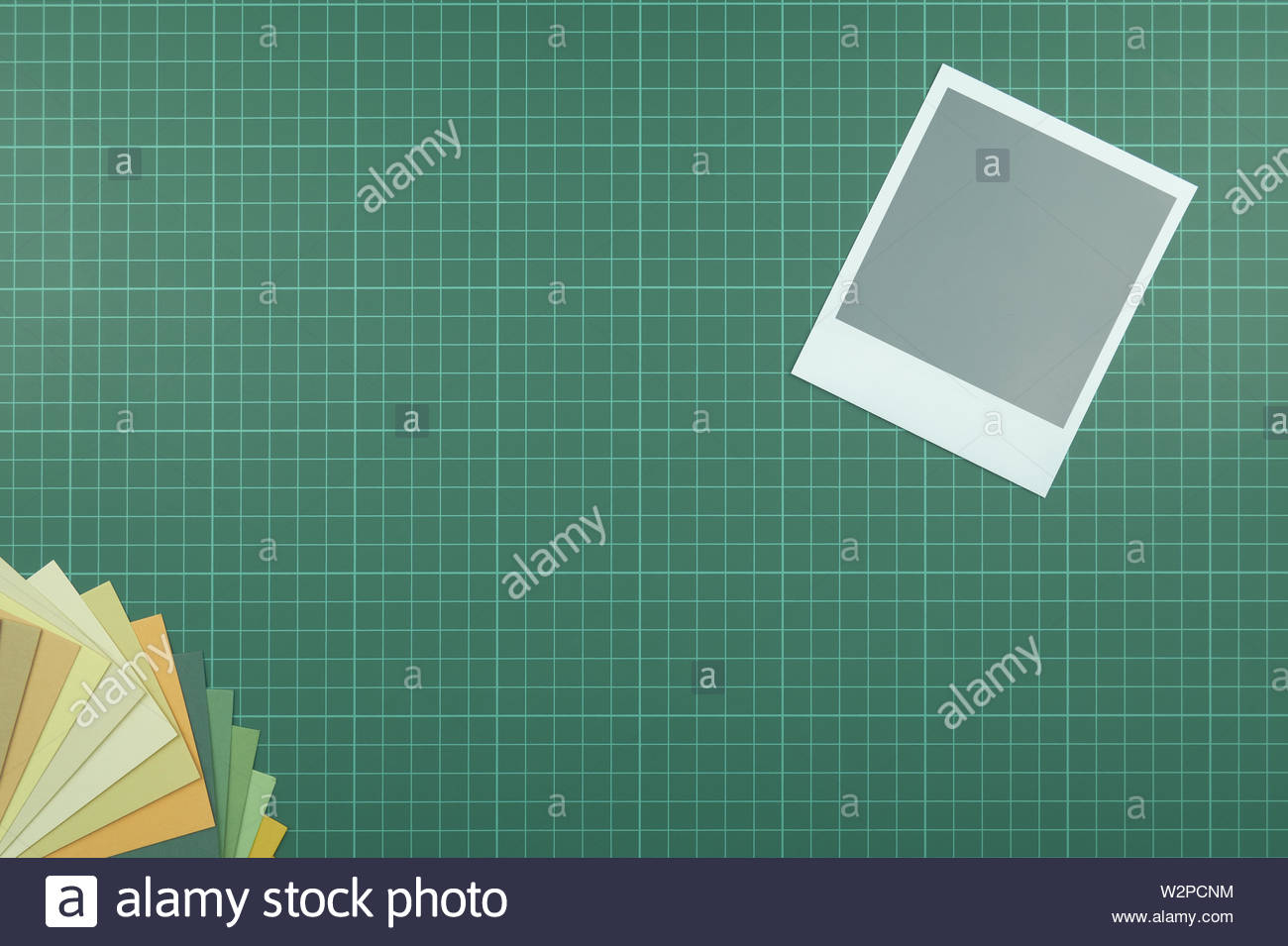 Blank Instant Film Style Photograph On Cutting Mat With Colour