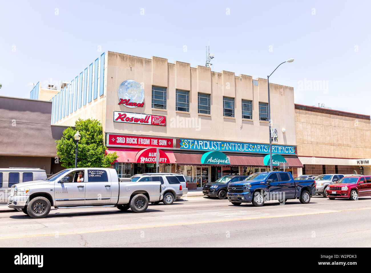 Roswell, USA - June 8, 2019: Main street road with cars in New Mexico town city alien sightings and store shop with ufo souvenirs Stock Photo