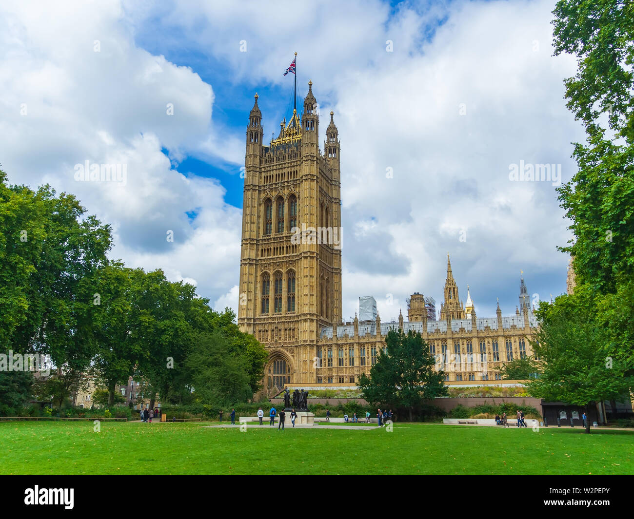 Palace of Westminster (Houses of Parliament) with Victoria Tower viewed from Victoria tower gardens, London, England, UK. Stock Photo