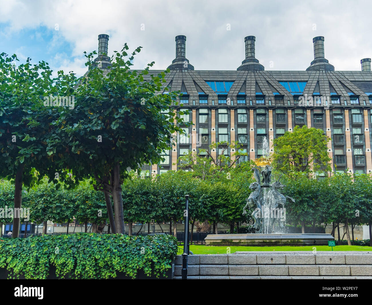 View over the New Palace Yard of the Westminster Palace showing its garden and the fountain to the Portcullis House, London, UK. Stock Photo
