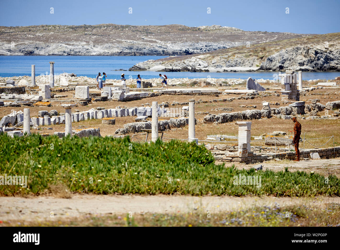 Greek, Greece, Delos historical site island, archaeological ruins with Antony Gormley statues Water* 2018 Stock Photo