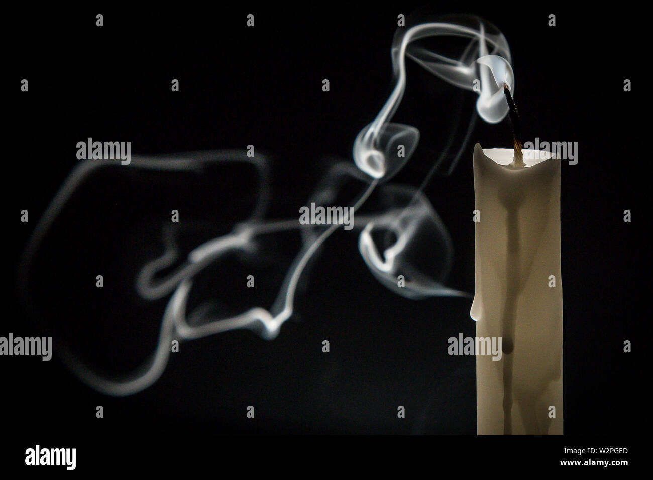 Smoke candle on a black background Stock Photo - Alamy