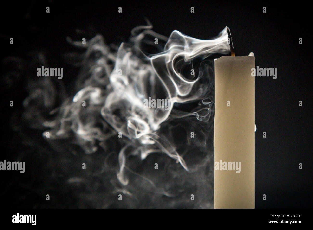 Smoke candle on a black background Stock Photo - Alamy