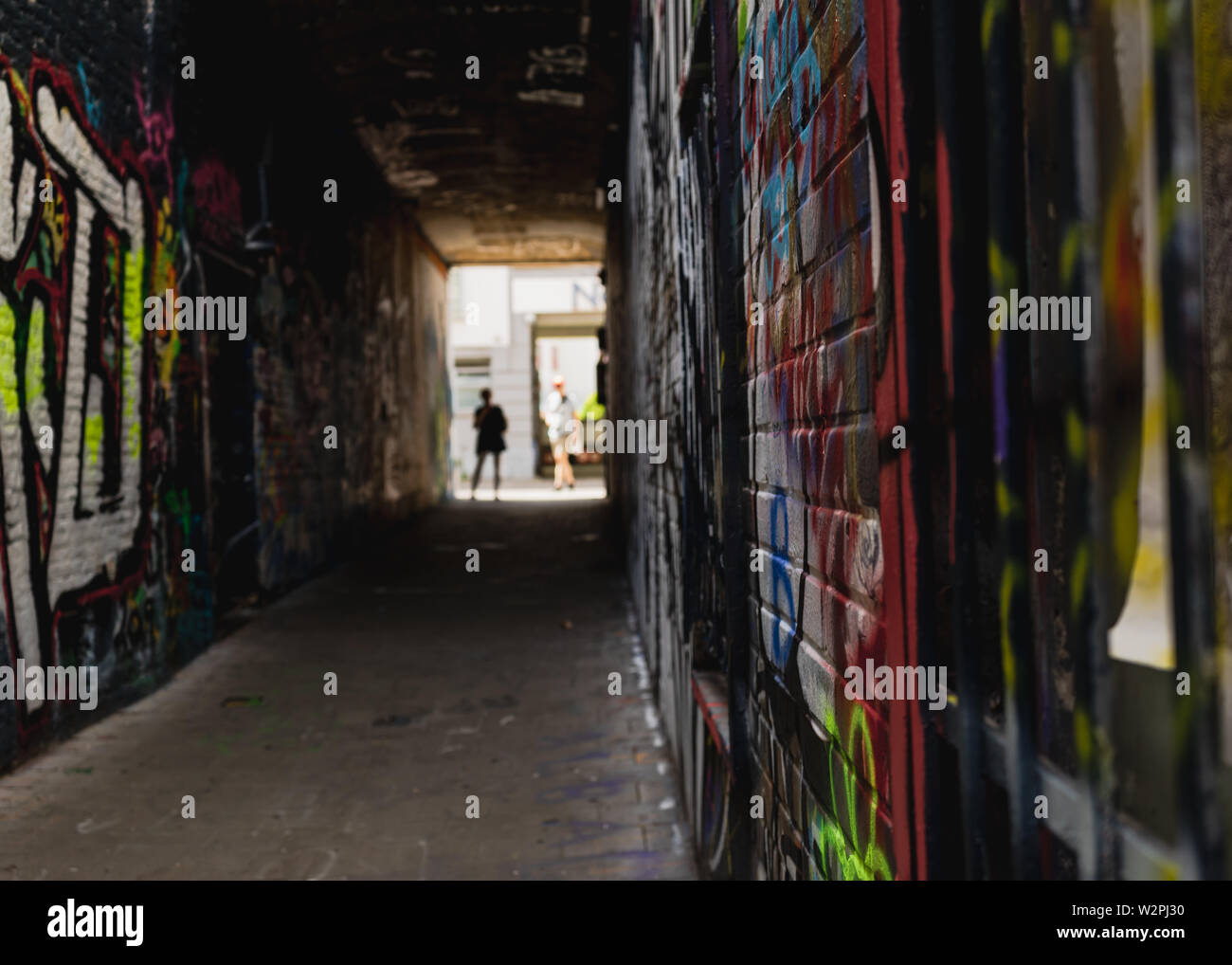 People at the end of Graffiti Street Legal street art, UNESCO world heritage Stock Photo Alamy