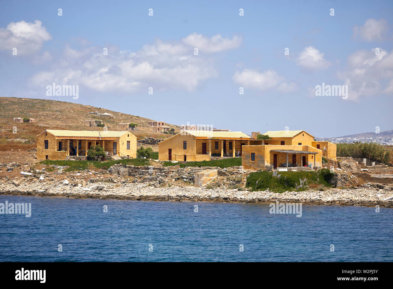 Delos historical, and archaeological ruins Mykonos, ˈmikonos Greek island, part of the Cyclades, Greece, Delos historical, yellow archaeologists house Stock Photo