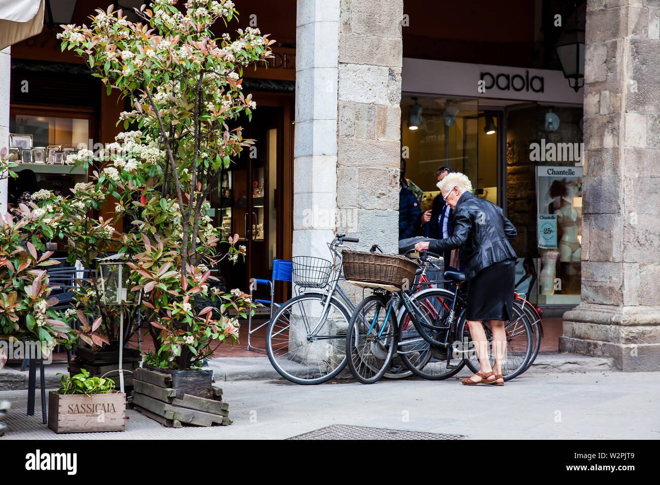 PISA, ITALY - APRIL, 2018: Senior lady biker at Pisa city center Stock Photo