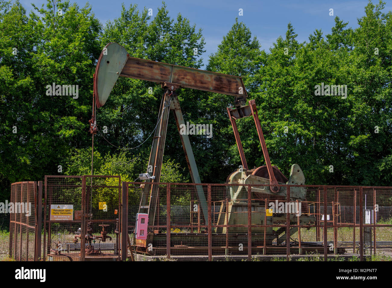 Nodding donkey oil derrick well pump Stock Photo Alamy
