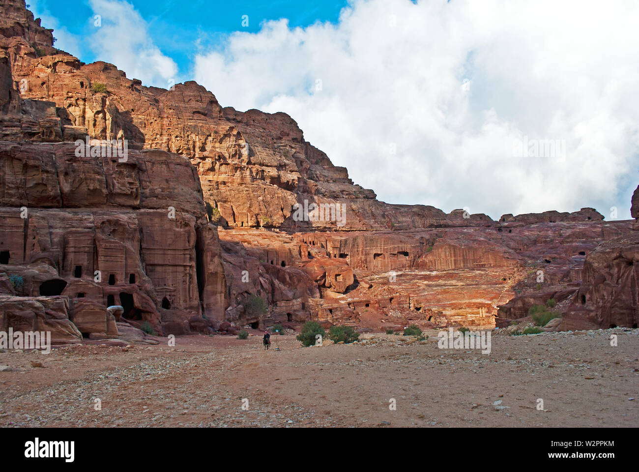Narrow passage of rocks of Petra canyon in Jordan. UNESCO World Heritage Site. Way through Siq gorge to stone city Petra. Stock Photo