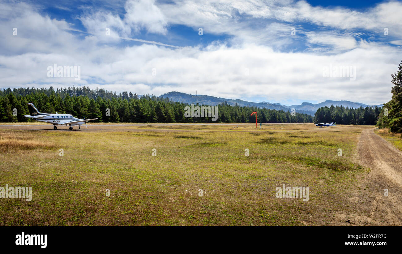 Private aircraft rest at the Nehalem Bay Airport, Oregon, USA Stock Photo