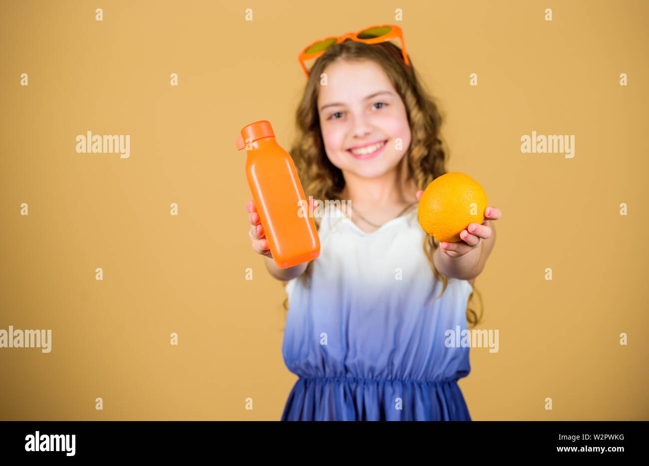 happy girl drink fresh orange juice. summer vacation. little girl in ...