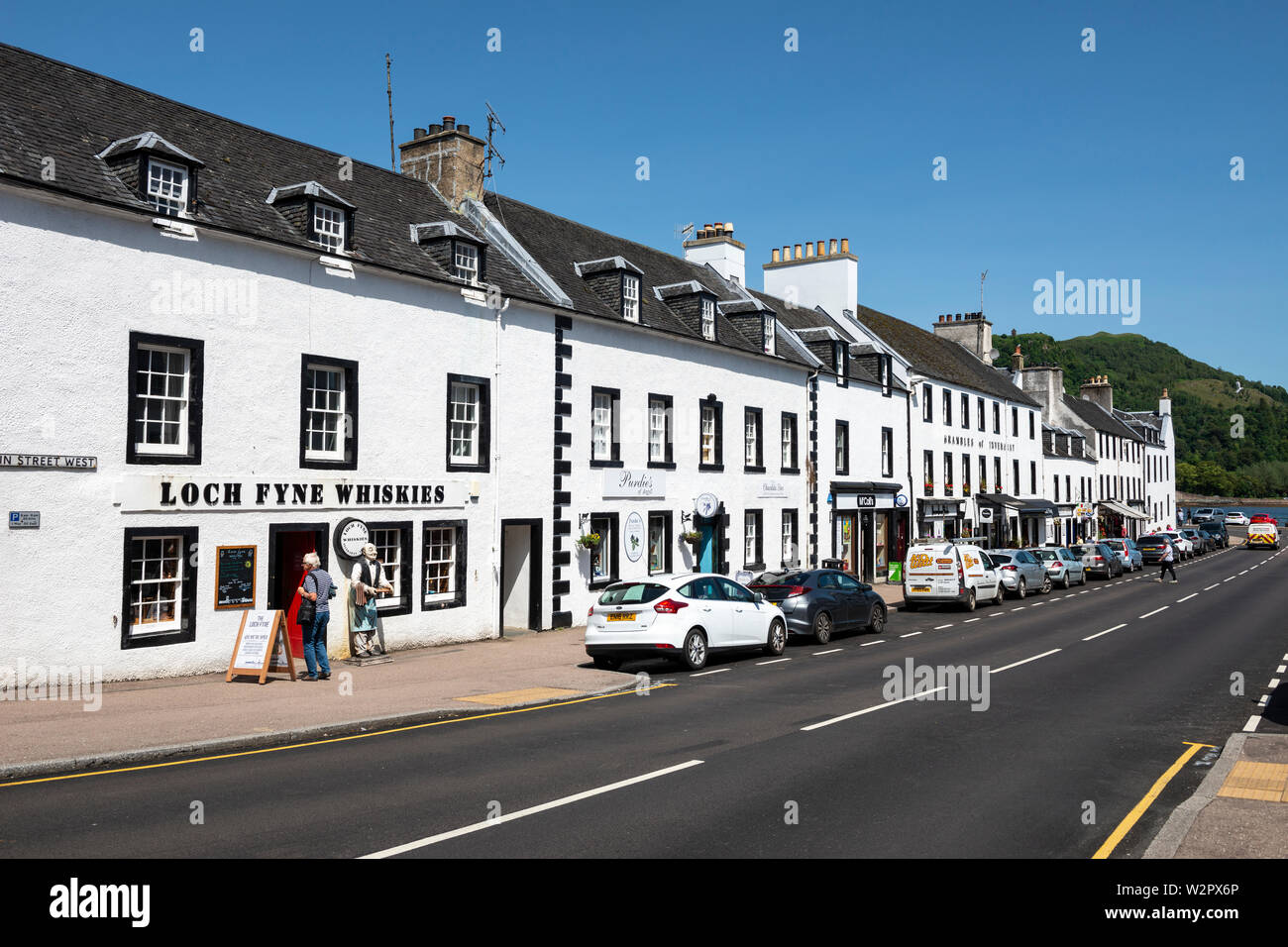 Loch Fyne Whiskies and other shops, hotels and restaurants along Main Street in Inveraray, Argyll and Bute, Scotland, UK Stock Photo