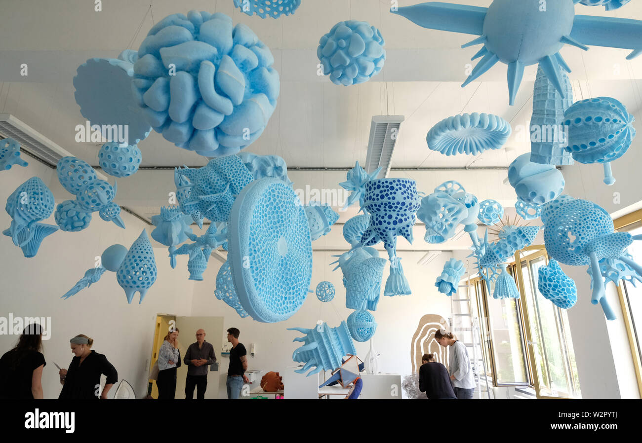 Halle, Germany. 10th July, 2019. Oversized replicas of unicellular creatures made of polystyrene hang in the design campus of Burg Giebichenstein Kunsthochschule Halle. The works originate from students of the first year of study at the institution and will be shown at the annual exhibition from 12 to 14 July 2019. Credit: Sebastian Willnow/dpa-Zentralbild/ZB - ATTENTION: Only for editorial use in connection with the current coverage of the exhibition during the duration of the exhibition and only with full mention of the above credit/dpa/Alamy Live News Stock Photo