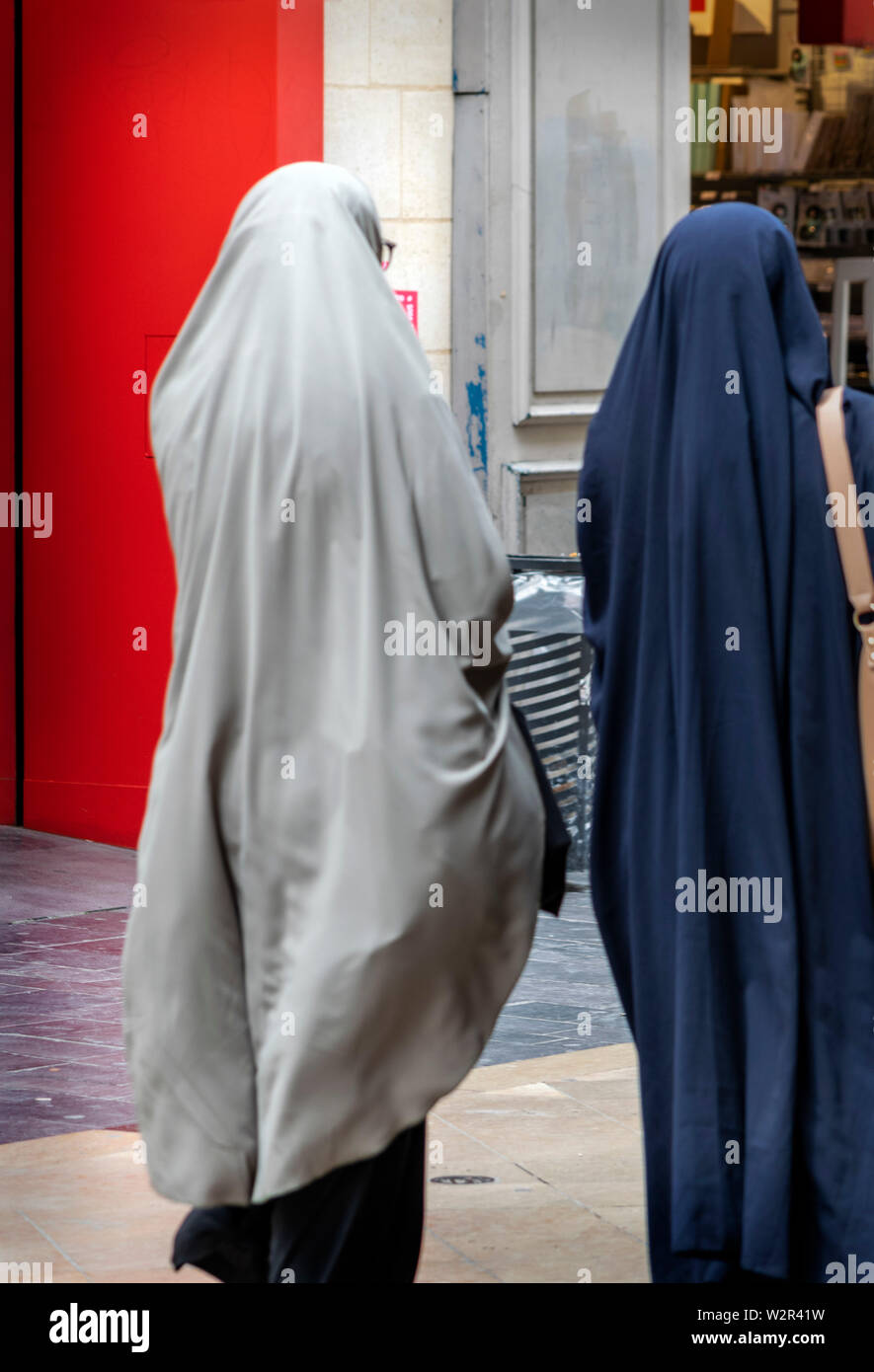Two ladies out shopping in Bordeaux wearing religious dress Stock Photo