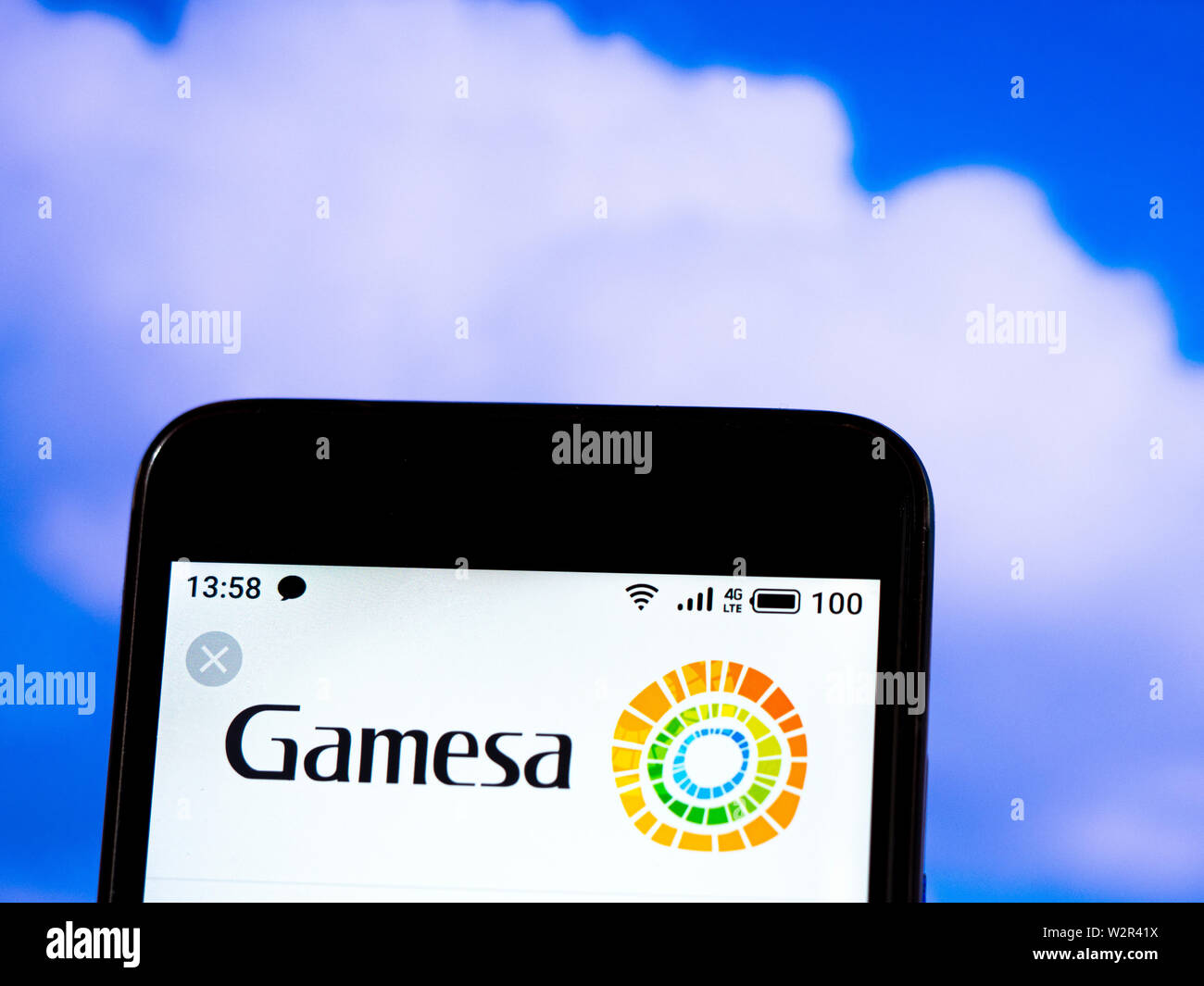 In this photo illustration the Gamesa Corporación Tecnológica logo is seen displayed on a smartphone Stock Photo