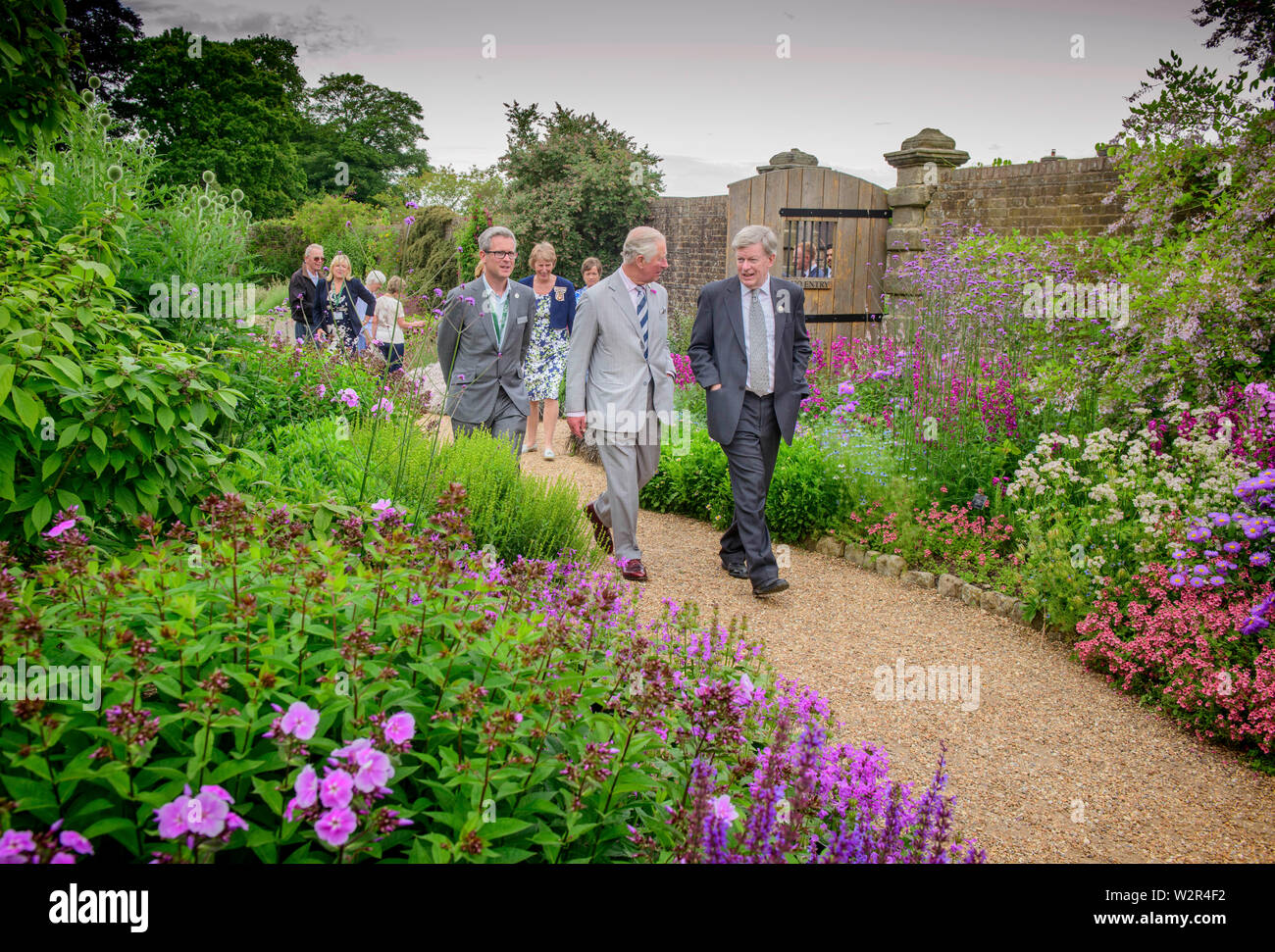 Ardingly, UK. 10th July, 2019. HRH Prince of Wales, Patron of The Royal Botanic Gardens, Kew, visited the Millennium Seed Bank at Wakehurst Ardingly, in West Sussex today. Nearly twenty years after he opened it. He also toured some of the gardens before visiting WakehurstÕs Coronation Meadow. Pictured with Tony Sweeney director of Wakehurst (right). Picture by Credit: Jim Holden/Alamy Live News Stock Photo