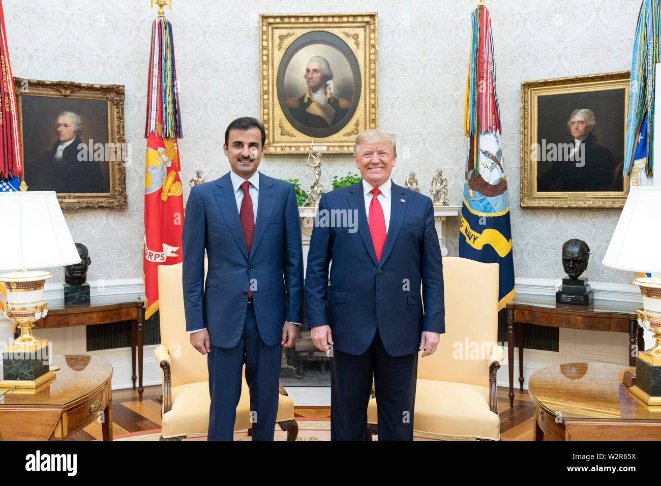 U.S President Donald Trump poses with the Emir of Qatar Tamin bin Hamad Al Thani before the start of their bilateral meeting in the Oval Office of the White House July 9, 2019 in Washington, DC. Stock Photo