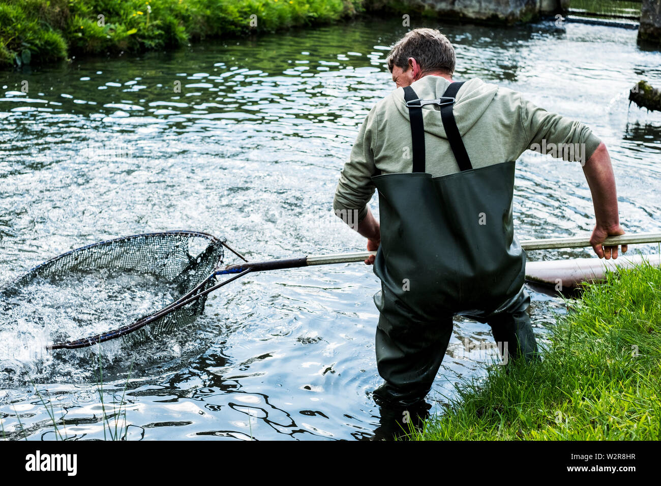 Man wearing waders hi-res stock photography and images - Alamy