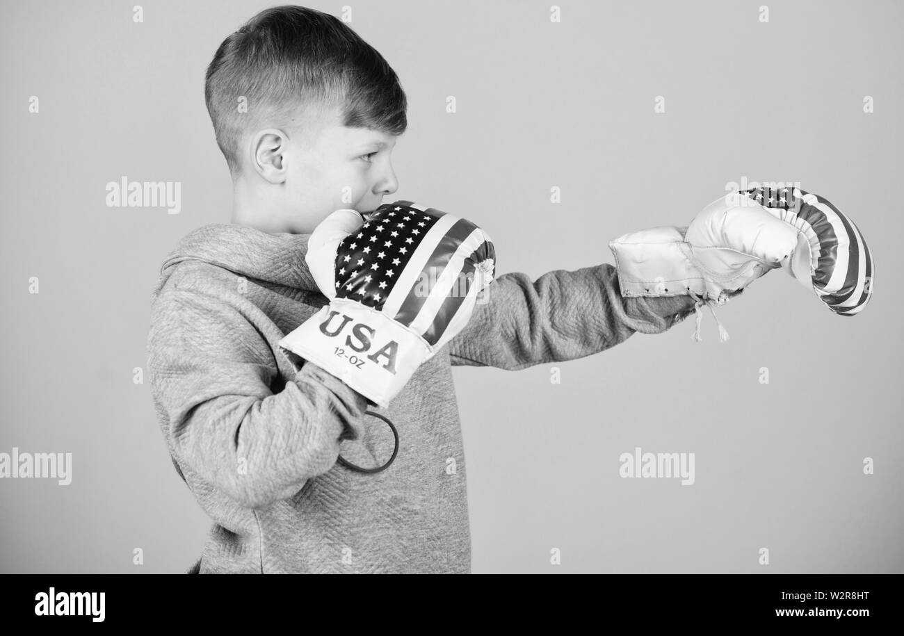 Ready for sparring. Confident in his strength. Start boxing career. Boy