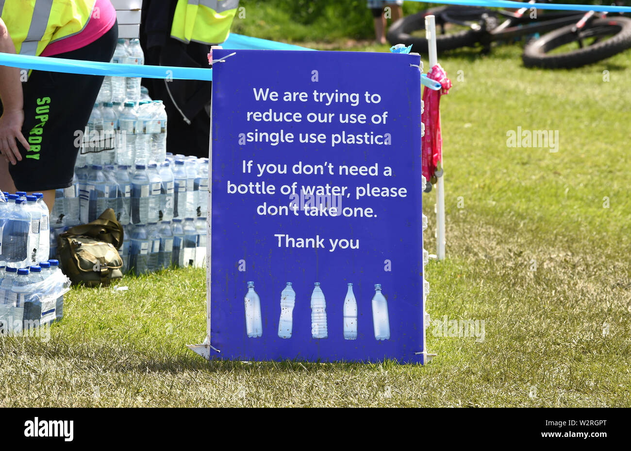 Sign highlighting plastic bottle of water use encouraging multiple use Stock Photo