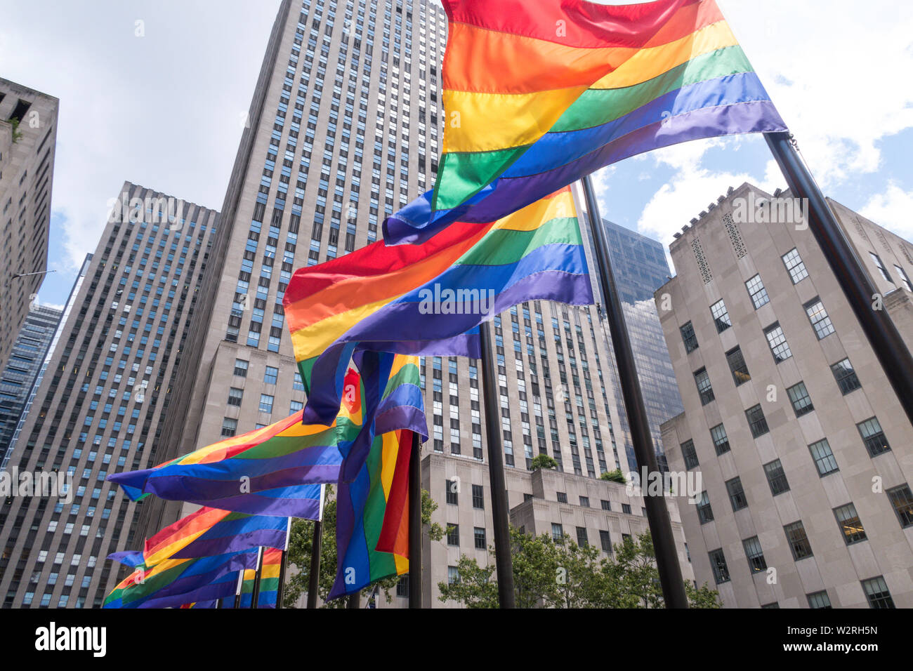Rainbow color flags celebrate WorldPride at Rockefeller Center Plaza, NYC, USA Stock Photo